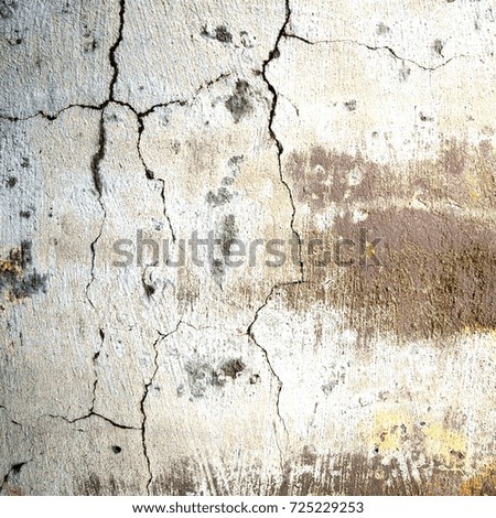 Old cracked wall of white color