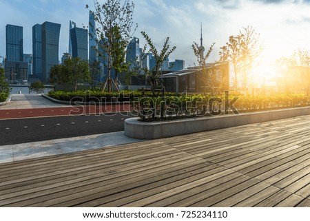 Empty wooden footpath front modern building in shanghai