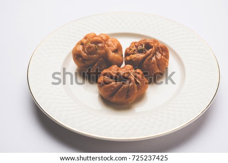 Stock photo of Balushahi, Indian sweet food made up of Maida floor, oil and sugar, selective focus