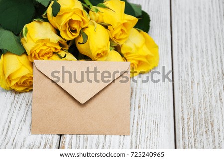 Yellow roses on a old wooden table