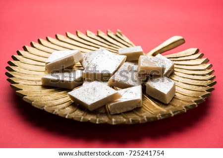 Stock photo of Kaju Katli, a popular indian sweet burfi made using milk, khoya, cachew and Sugar