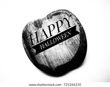 Silhouette pattern of closeup top view of wooden saucer with happy halloween banner on white background.