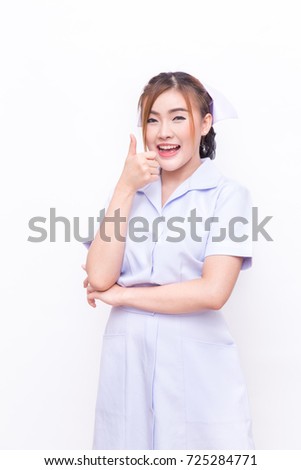 Beautiful and attractive Asian young nurse wearing full nurse white uniform looking at camera with different posing on white background
