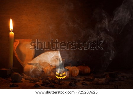 pot, pumpkin Mold with oil clay On a wooden table halloween concept