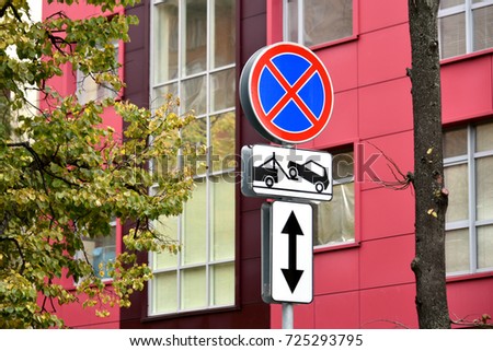 No stopping sign on the background of the red building