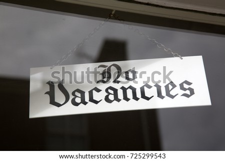 No Vacancies Sign in Hotel Window