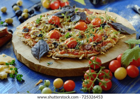 Italian cuisine. Pizza with tomato and sausages.