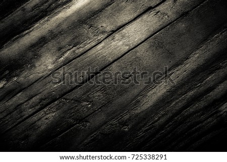 Wooden burned rustic texture for background. Rough weathered wooden board. Toned.