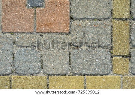 Multicolored Sidewalk Tile Texture. The Texture of Artificial Stone Pavers of Different Colors