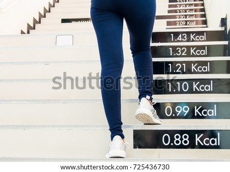 Legs of women walk and run up the stairs, Burn fat in the body. Royalty-Free Stock Photo #725436730