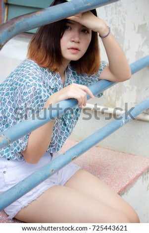 Portrait of thai adult beautiful girl short hair relax and smile