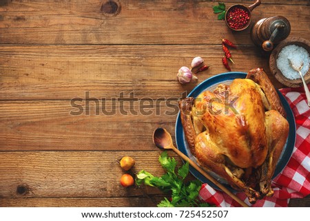 Christmas or Thanksgiving turkey on rustic wooden table
