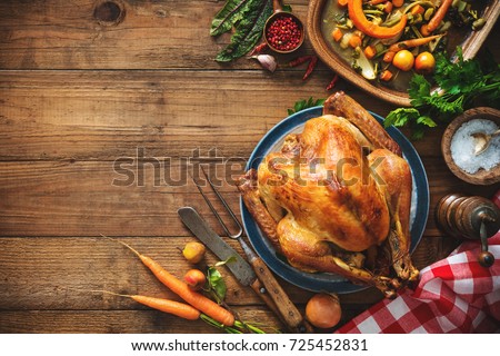 Christmas or Thanksgiving turkey on rustic wooden table