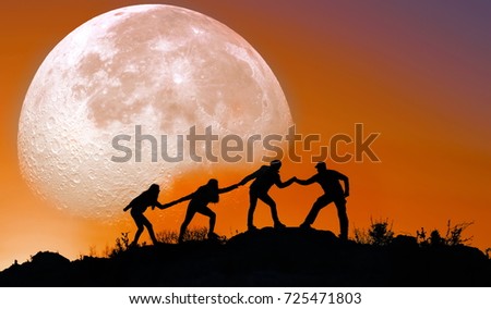 Human silhouettes and moon in the mountain