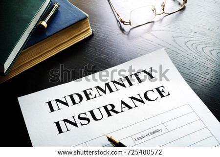 Indemnity insurance policy in an office. Royalty-Free Stock Photo #725480572