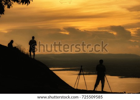 Photographers are shooting sunset.