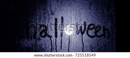 halloween, inscription on the window, drops of water