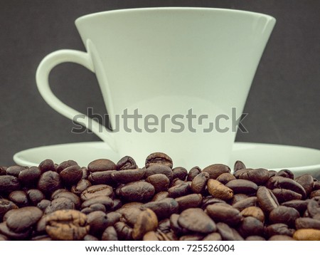 Coffee Bean with White Cup on Black Background
