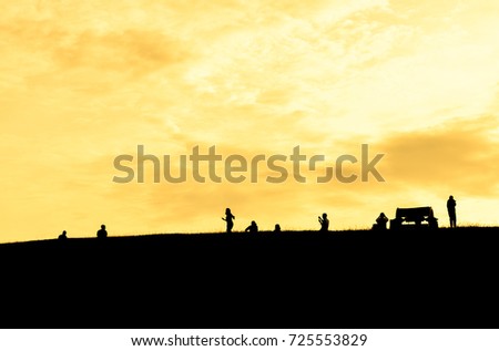 silhouette meadow and people  with background sky and sunset 