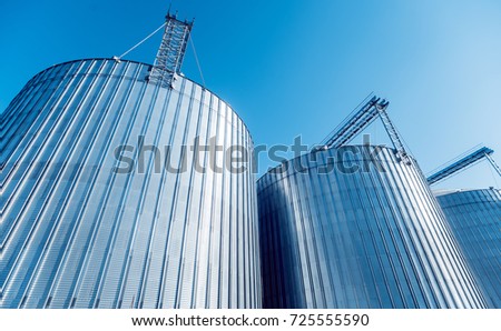 Modern silos for storing grain harvest. Agriculture. Background