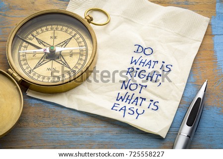 Do what is right, not what is easy  advice or reminder - handwriting on a napkin with an antique brass compass Royalty-Free Stock Photo #725558227