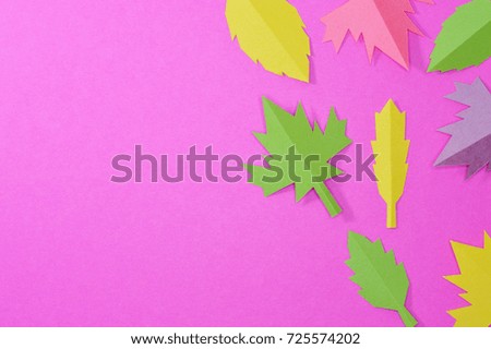 Handmade autumn leaves of different colors arranged creatively for your autumn projects or crafts publications.
