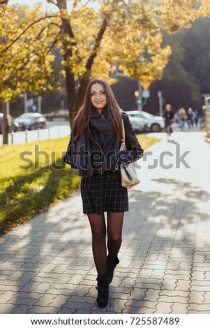 Young fashion girl walk on the street