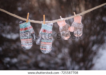 mittens on rope in frosty weather