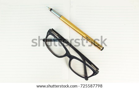 Pen and Specs in the notebook