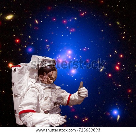 Astronaut and starfield. The elements of this image furnished by NASA.
