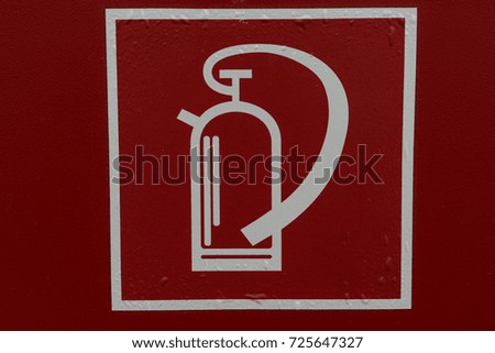 fire extinguisher sign retro style on red background in white lines