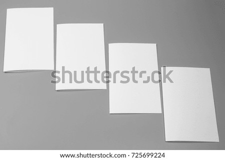 Blank portrait A4. brochure magazine isolated on gray, changeable background / white paper isolated on gray