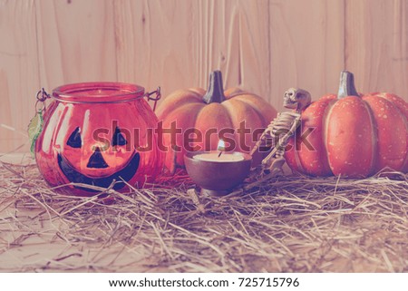 vintage tone image of Halloween pumpkin and vary ornament on wood table with Wooden background .