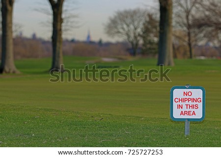 No Chipping in this Area Golf Course Sign with the New York City Skyline in the Background