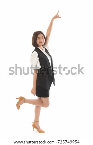 Portrait of smiling asian business woman pointing finger on copy space isolated on white background. Concept of success.