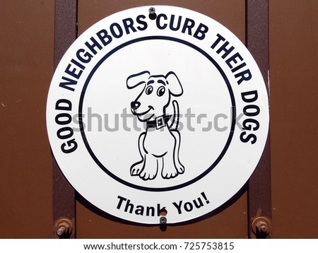 A sign requesting  the need to keep your dog under control in this environment                          