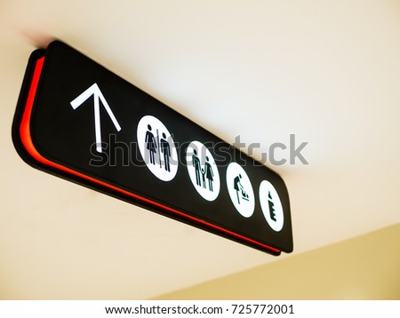 Illuminated signboard in shopping mall including toilet, mom & baby room and baby diaper change room.