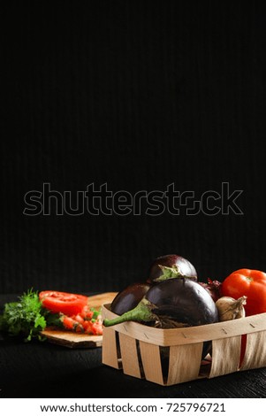 a set of vegetables - eggplant, tomato, onion, garlic, greens (dill) 