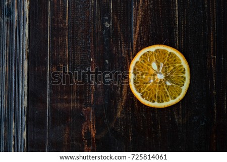 Close focus of hand holding sweet oranges cut off with copy space for text or advertising