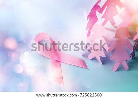 Sweet pink ribbon shape with girl paper doll on blue background  for Breast Cancer Awareness symbol to promote  in october month campaign