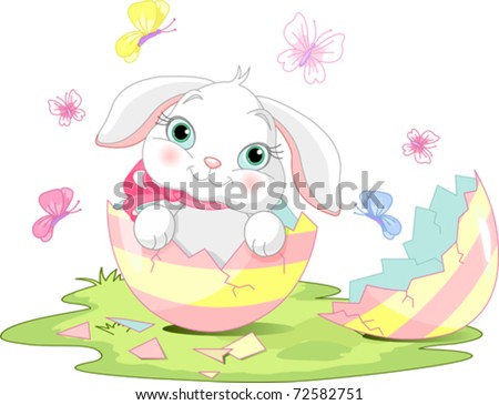 Easter bunny sitting in the broken Easter Egg.