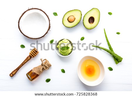 Natural herbal skin care products, top view ingredients coconut, mint, aloe vera, avocado,egg,honey on table concept of the best all natural face moisturizer. Facial treatment preparation background.
 Royalty-Free Stock Photo #725828368