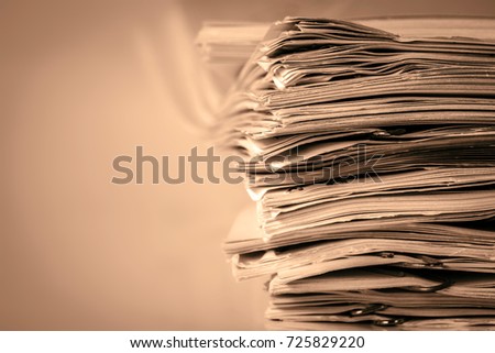 extremely close up  report paper stacking of office working document , retro color tone