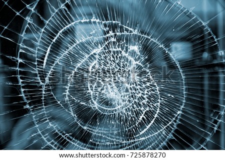 Broken glass abstract pattern. Damaged window closeup background