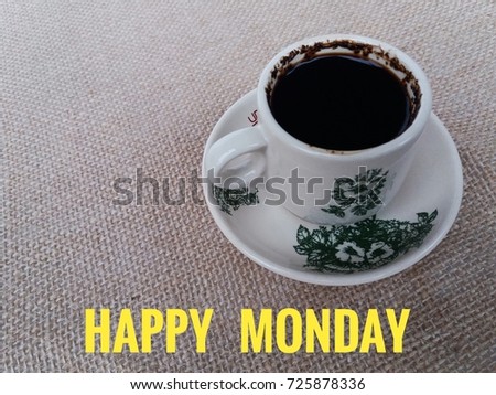 Concept image a cup of coffee and word - HAPPY MONDAY with selective focus