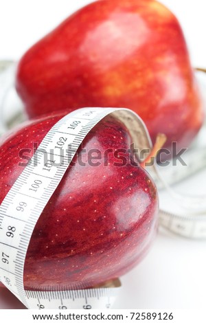 apple and measure tape isolated on white