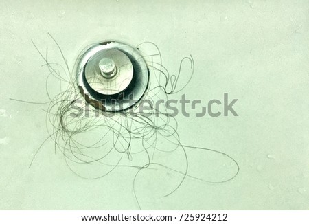 Hair Lost tumbled in the basin  Royalty-Free Stock Photo #725924212