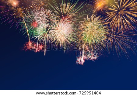 Colourful Fireworks  on blue twilight background to celebrate 2018 new year eve occasion with copy space for text insertion, decoration at bottom, holiday or new year celebration concept background