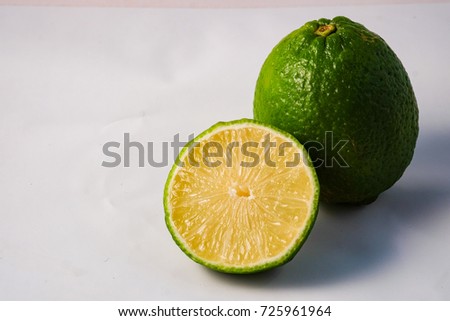 Green lemon on white background 