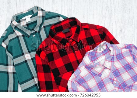 Green, red and lavender plaid shirts. Fashionable concept